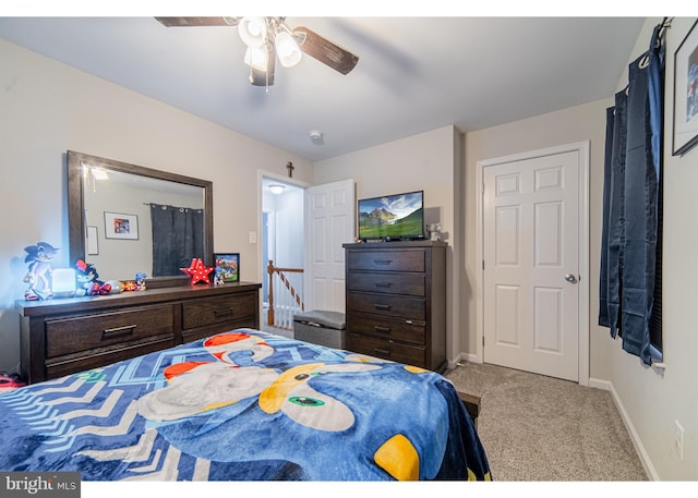 bedroom featuring ceiling fan and light colored carpet