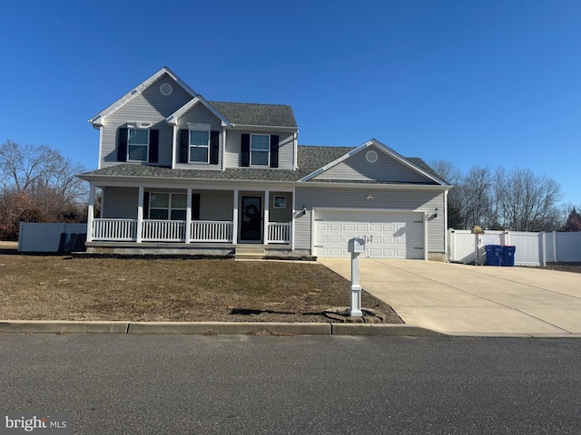 view of front facade with a garage and covered porch