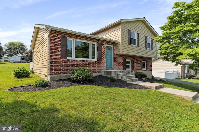 split level home featuring a front lawn