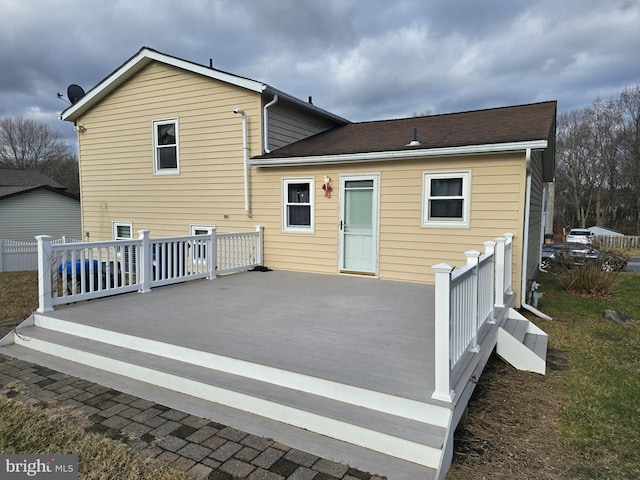 rear view of property with a deck