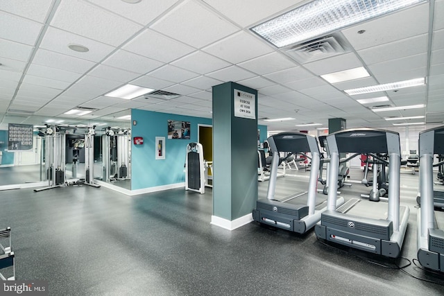 gym with a drop ceiling