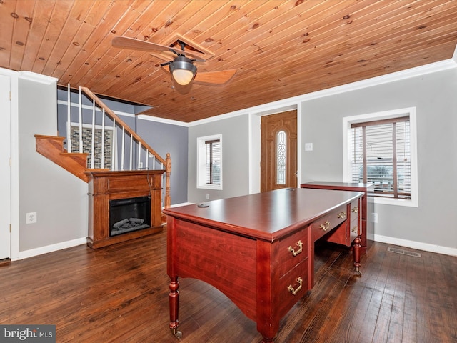 office space featuring crown molding, dark wood finished floors, visible vents, wood ceiling, and baseboards