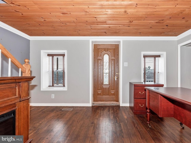 foyer featuring crown molding, wooden ceiling, dark wood finished floors, and baseboards