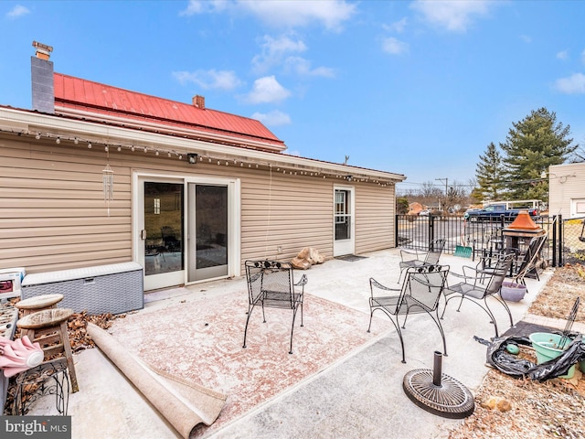 view of patio featuring fence