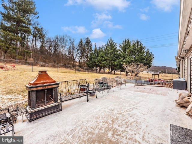 view of patio featuring a fenced backyard and central AC