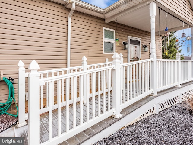 view of exterior entry with covered porch