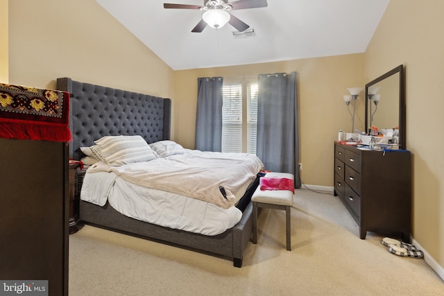 bedroom with lofted ceiling, baseboards, light carpet, and visible vents