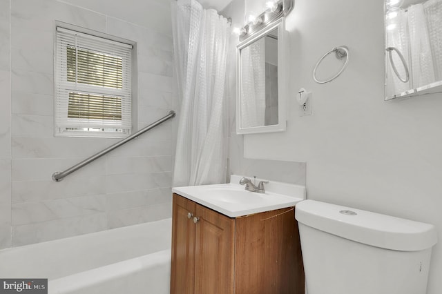 full bathroom featuring vanity, shower / bath combination with curtain, and toilet