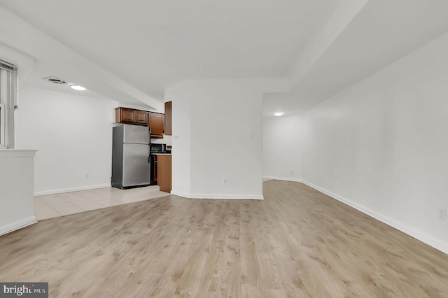 unfurnished living room with light wood-type flooring