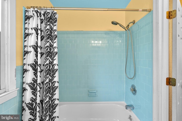 full bath featuring shower / bath combination with curtain