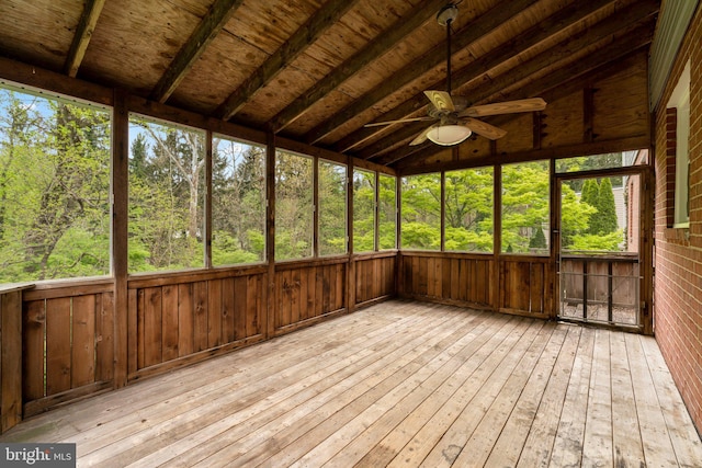 unfurnished sunroom featuring ceiling fan
