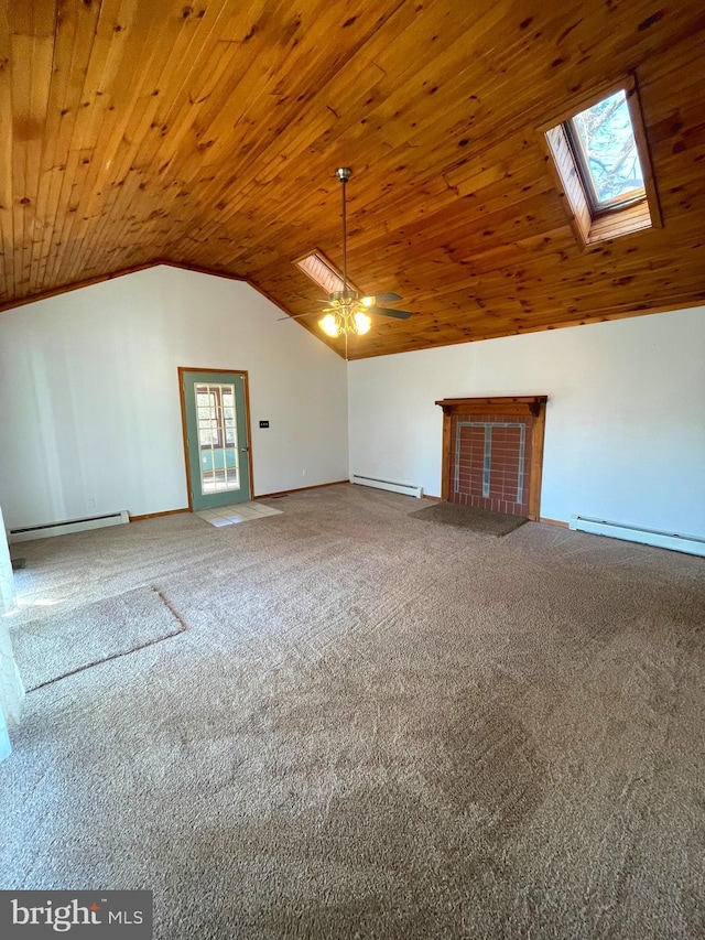 interior space with lofted ceiling with skylight, a baseboard heating unit, wood ceiling, and carpet flooring