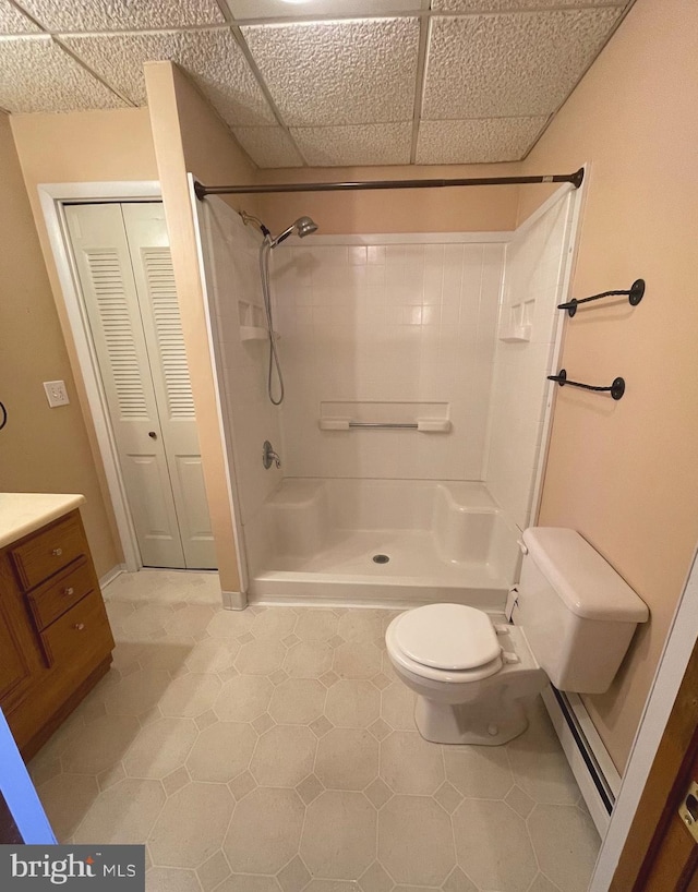 bathroom with vanity, toilet, and a shower