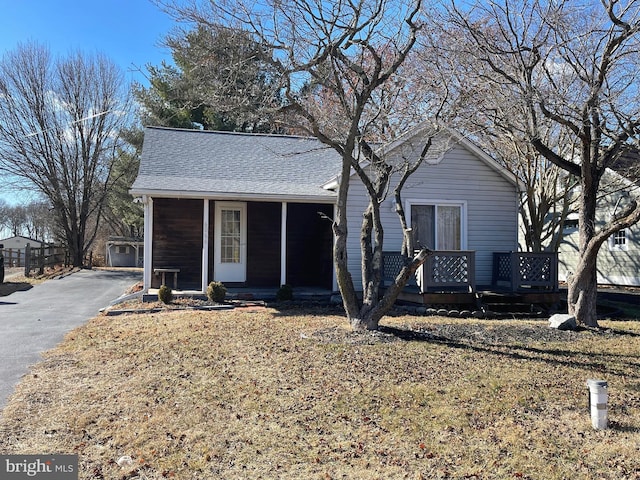 view of front facade with a garage and an outdoor structure