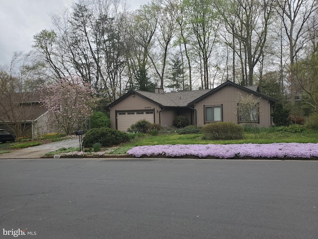 single story home with a garage