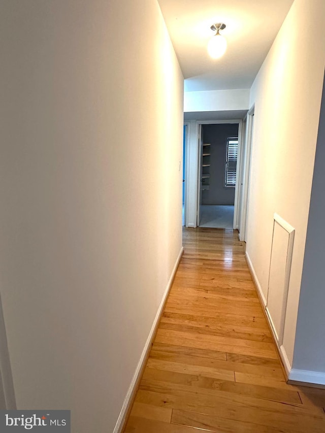 corridor featuring light wood-type flooring