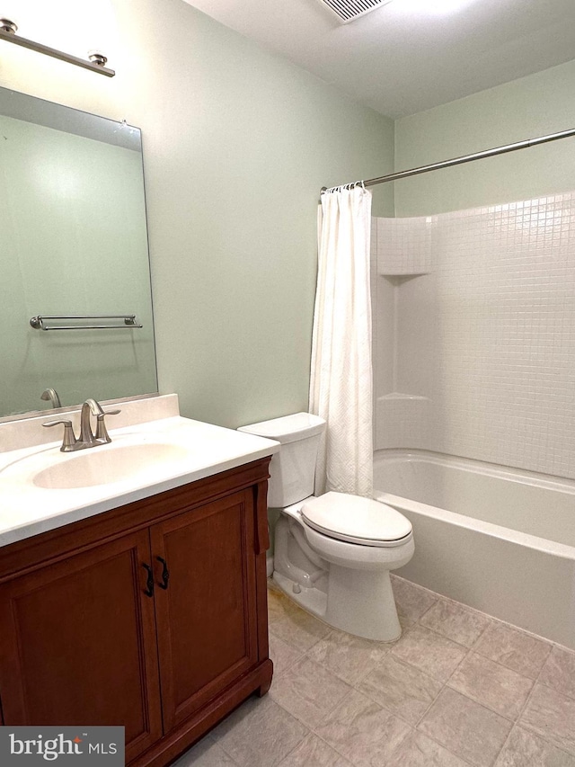 full bathroom featuring vanity, shower / bath combo, and toilet