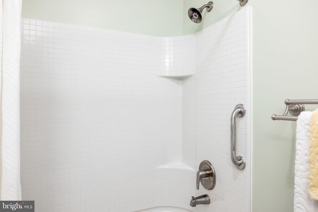 interior details featuring shower / bath combo with shower curtain