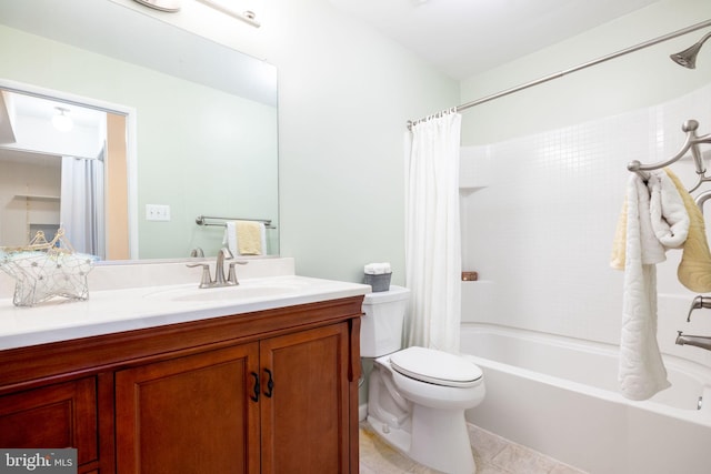 full bathroom featuring vanity, shower / bath combination with curtain, tile patterned floors, and toilet