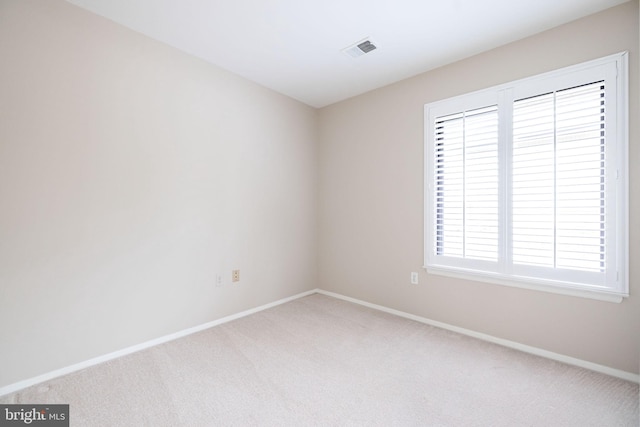 empty room with carpet flooring