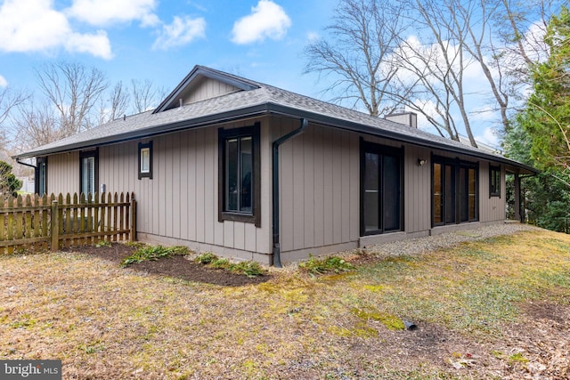 view of home's exterior with a yard