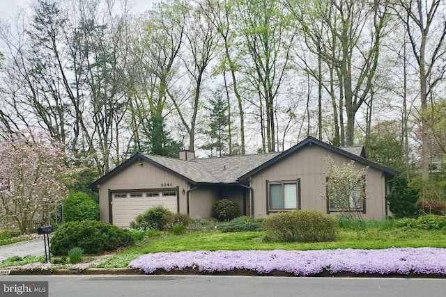 ranch-style house featuring a garage