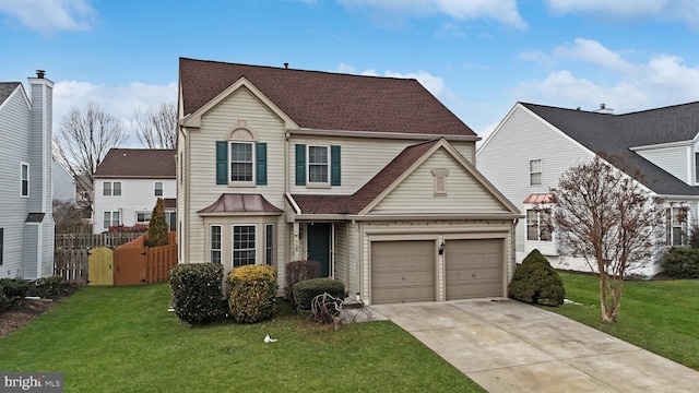 view of property featuring a front lawn