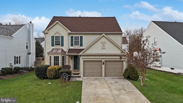 view of front property with a front lawn and a garage