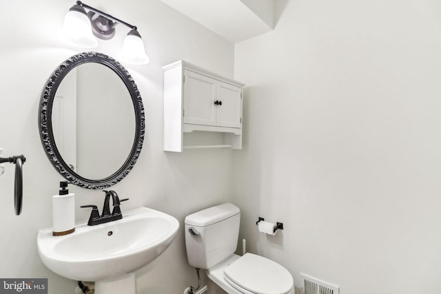 bathroom with sink and toilet