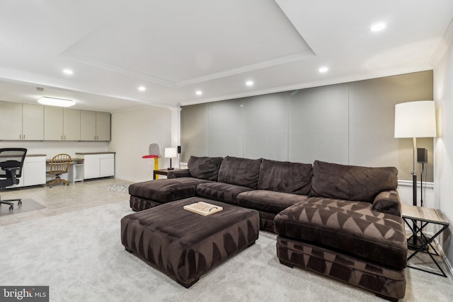 living room with a raised ceiling and crown molding