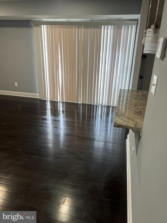 empty room featuring dark hardwood / wood-style floors