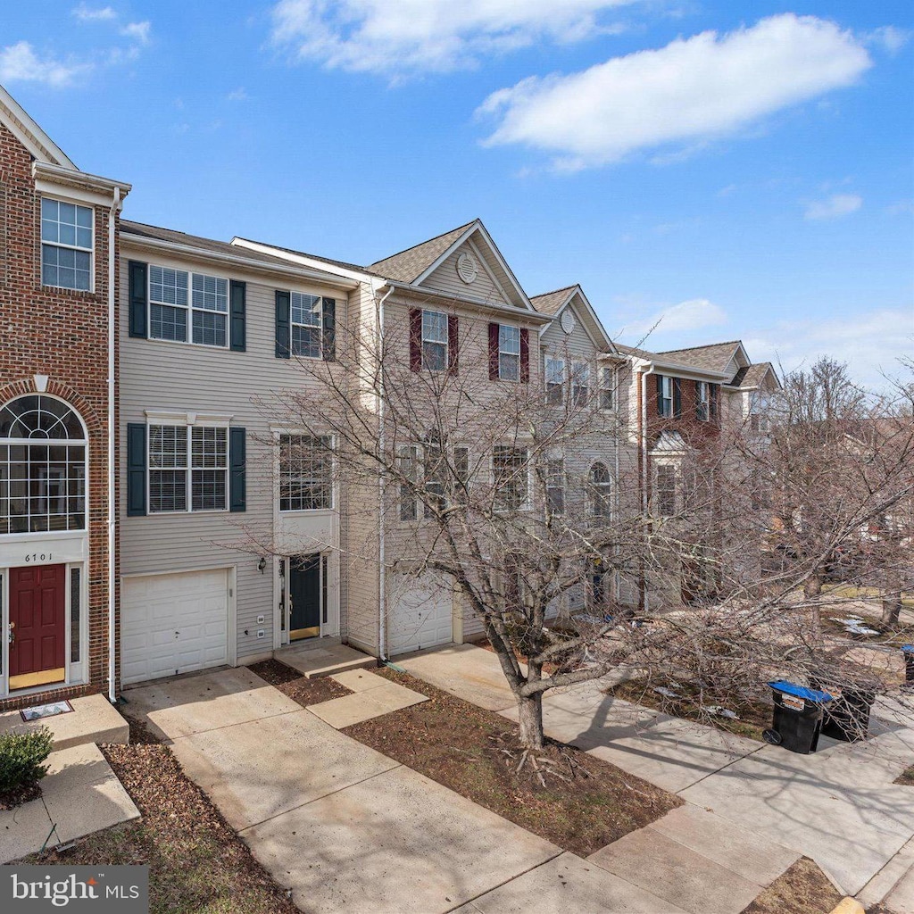 townhome / multi-family property with a garage