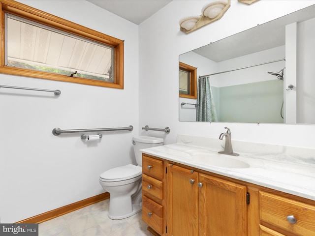 bathroom with vanity, a shower with curtain, and toilet