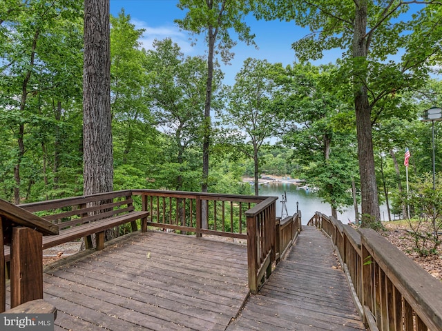 wooden deck featuring a water view