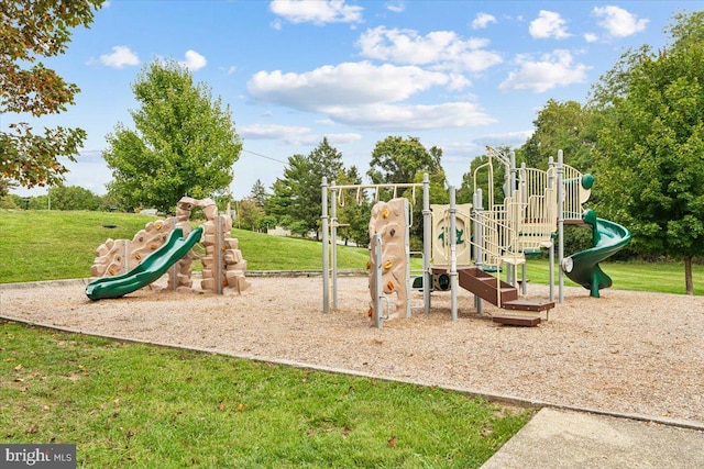 view of jungle gym featuring a lawn