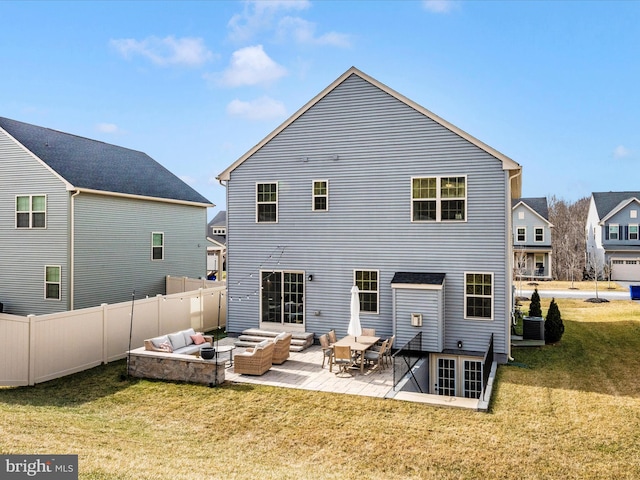 rear view of property with cooling unit, a patio, outdoor lounge area, and a lawn