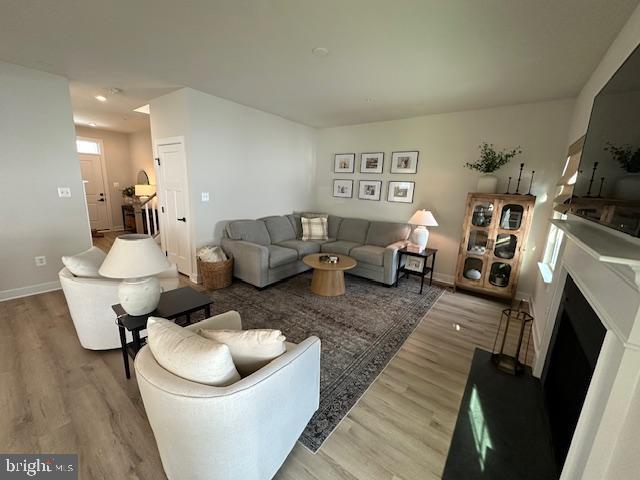 living room with light hardwood / wood-style floors