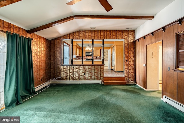 carpeted spare room with vaulted ceiling with beams, ceiling fan with notable chandelier, and baseboard heating