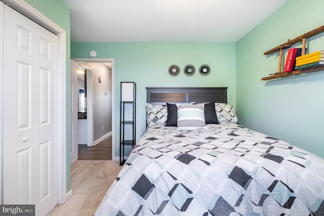 carpeted bedroom with a closet