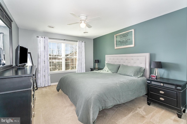 bedroom with light colored carpet and ceiling fan