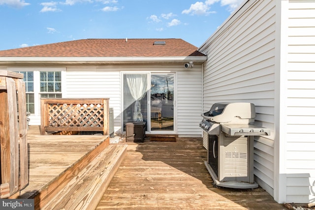 wooden terrace featuring grilling area