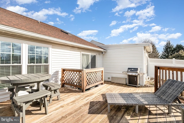 wooden terrace featuring grilling area