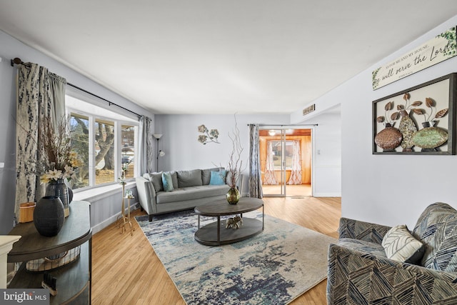 living room with light hardwood / wood-style floors