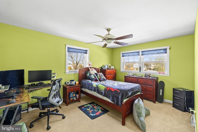 carpeted bedroom with ceiling fan