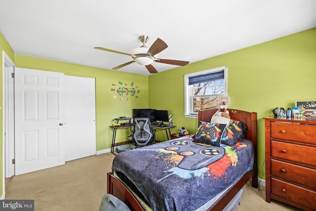 carpeted bedroom featuring ceiling fan