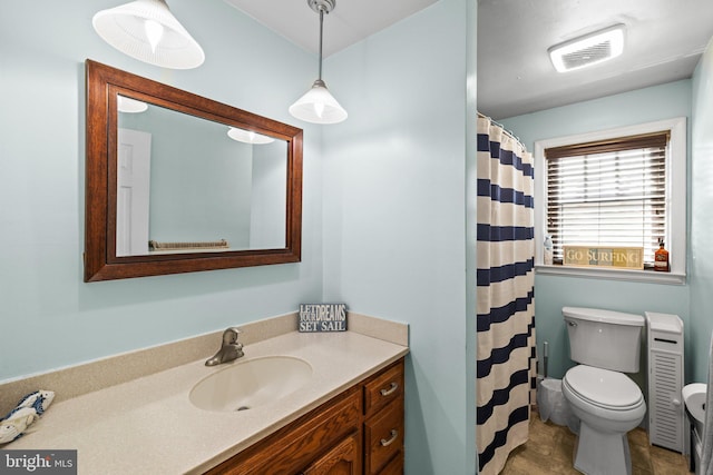 bathroom with vanity and toilet