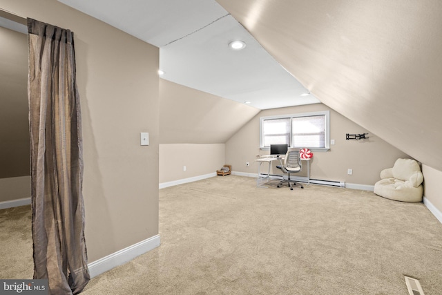 unfurnished office featuring lofted ceiling, a baseboard heating unit, and carpet floors