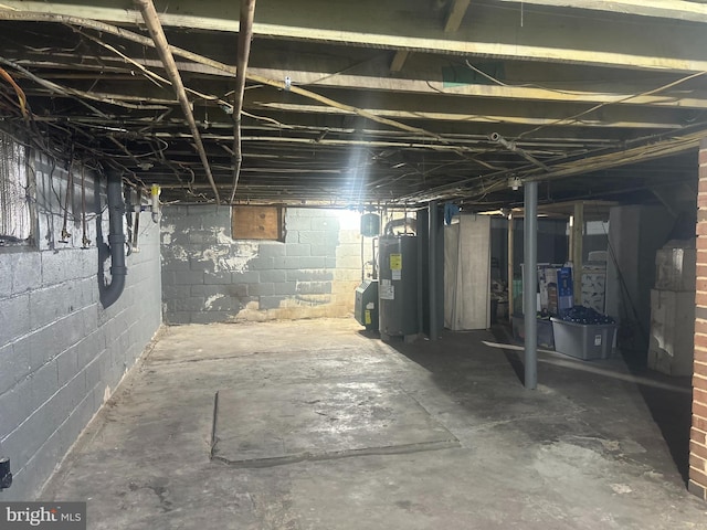 unfinished basement with electric water heater