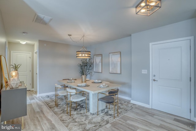 dining space featuring light hardwood / wood-style floors