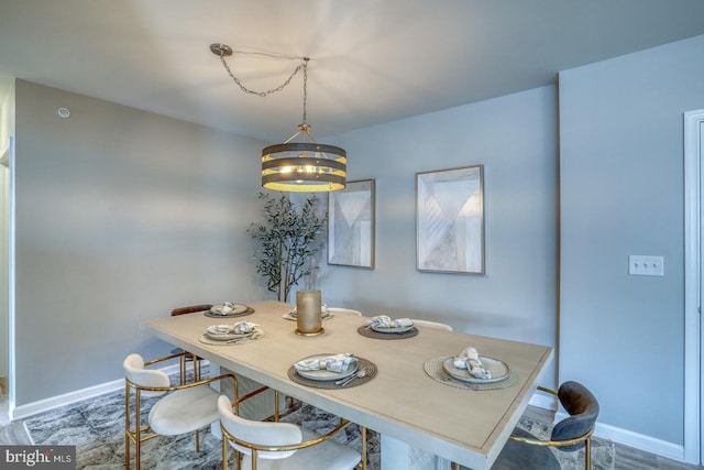 dining area featuring a chandelier